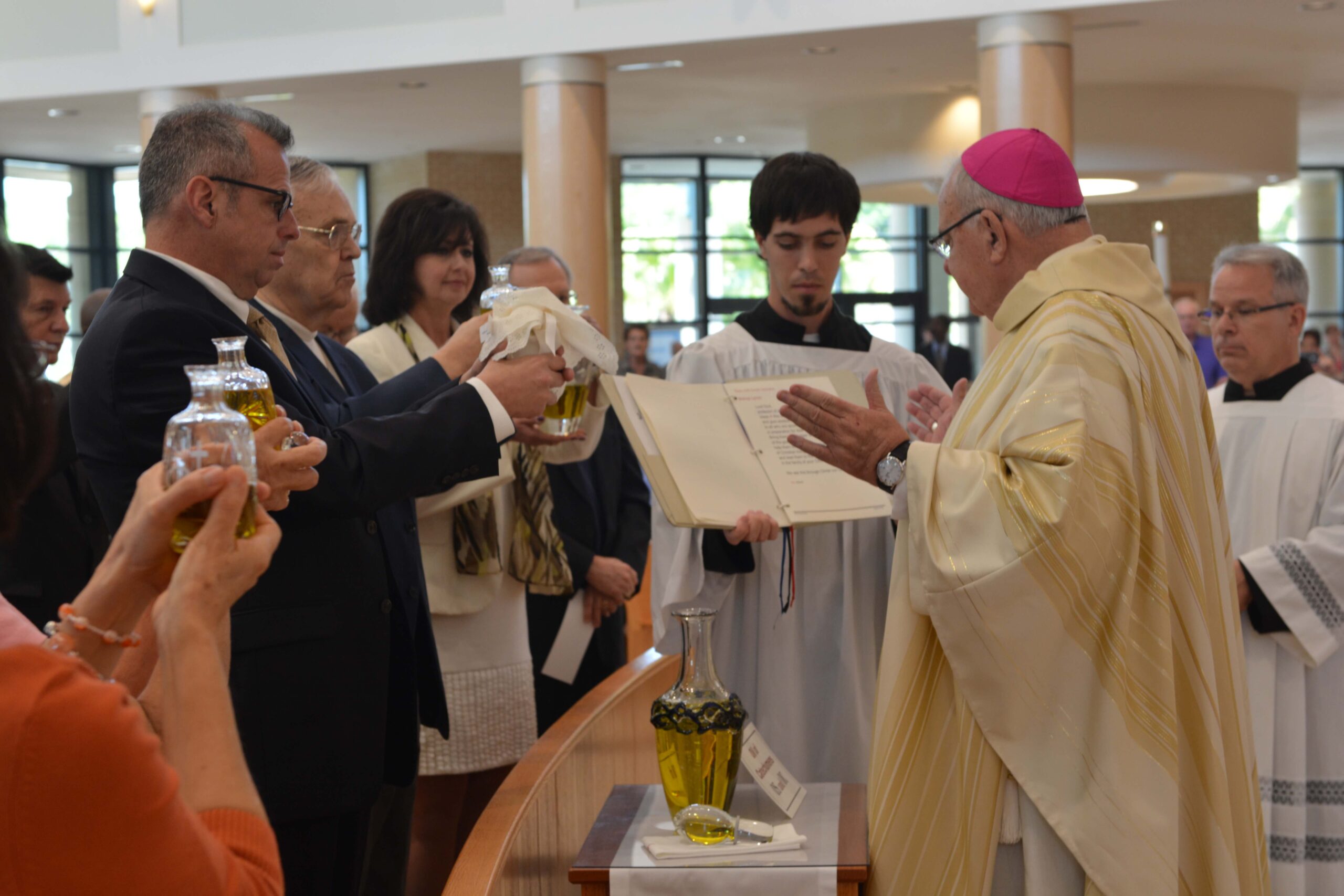 Bishop Lynch blessing the Oil of Catechumens. Photo credit: Maria Mertens