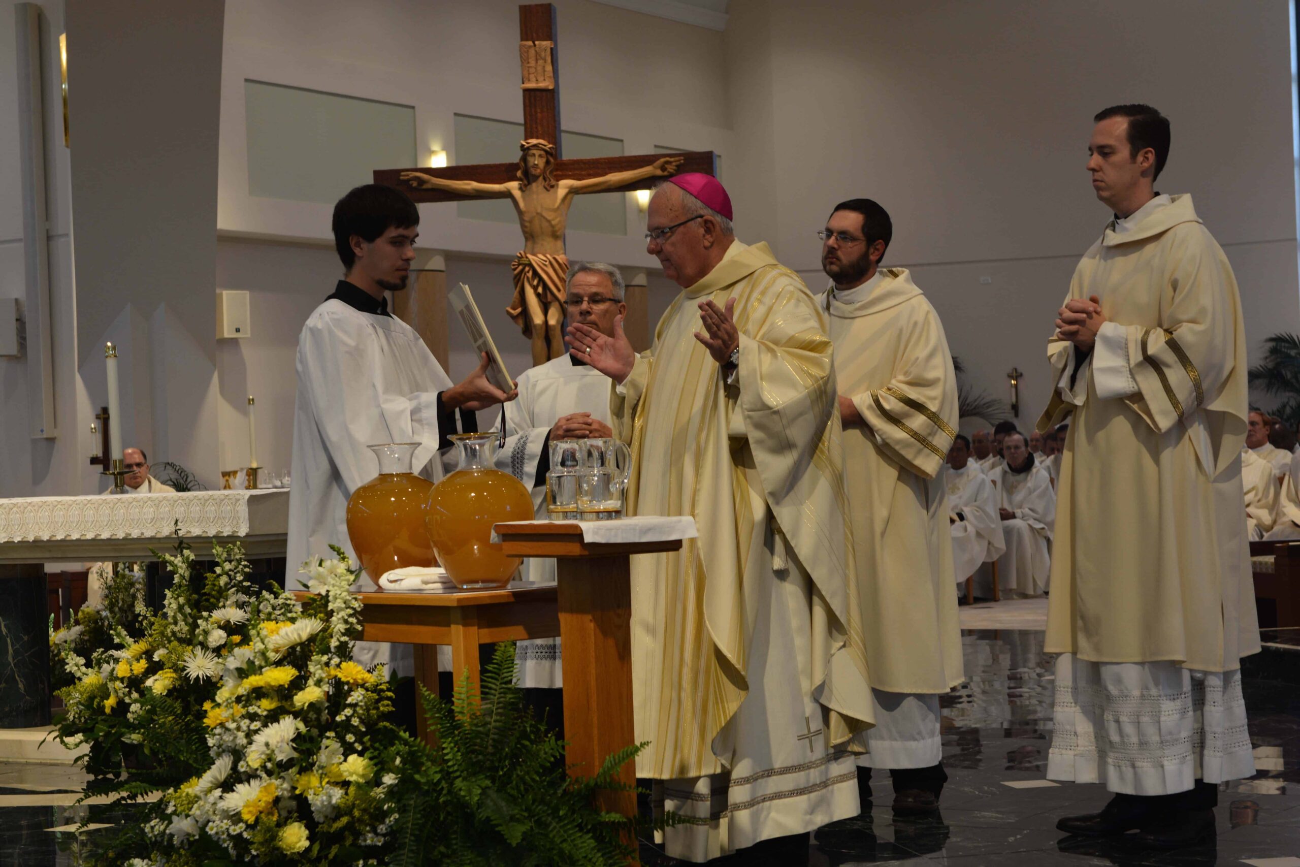 Bishop Lynch consecrating the Sacred Chrism. Photo credit: Maria Mertens