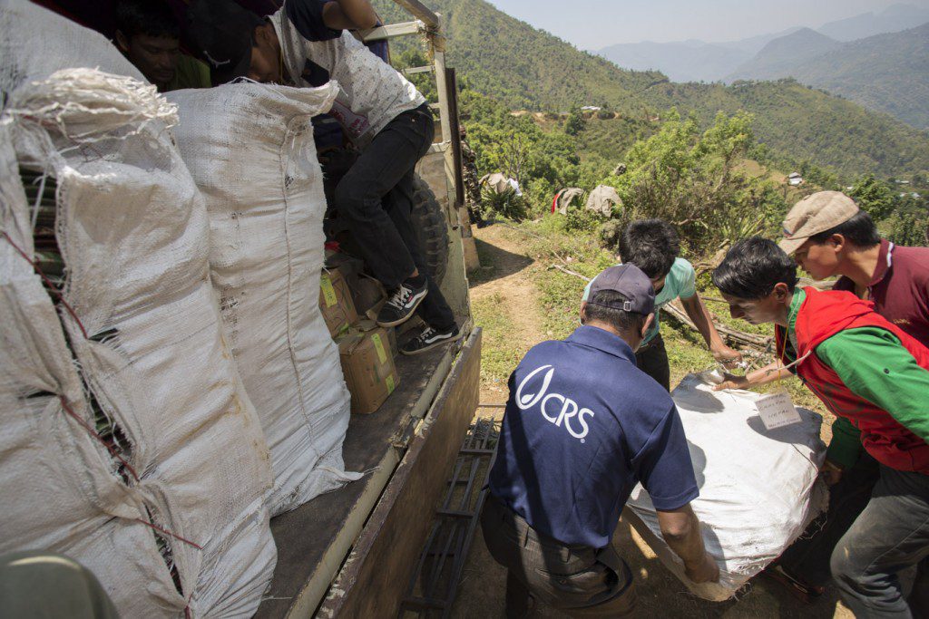 CRS' distribution in Gorkha district in Nepal. CRS staff distributed shelter and WASH kits to an initial 1,250 people in a village in the district, which is outside of Kathmandu and had so far not received any assistance. (CRS Photo / Jake Lyell)